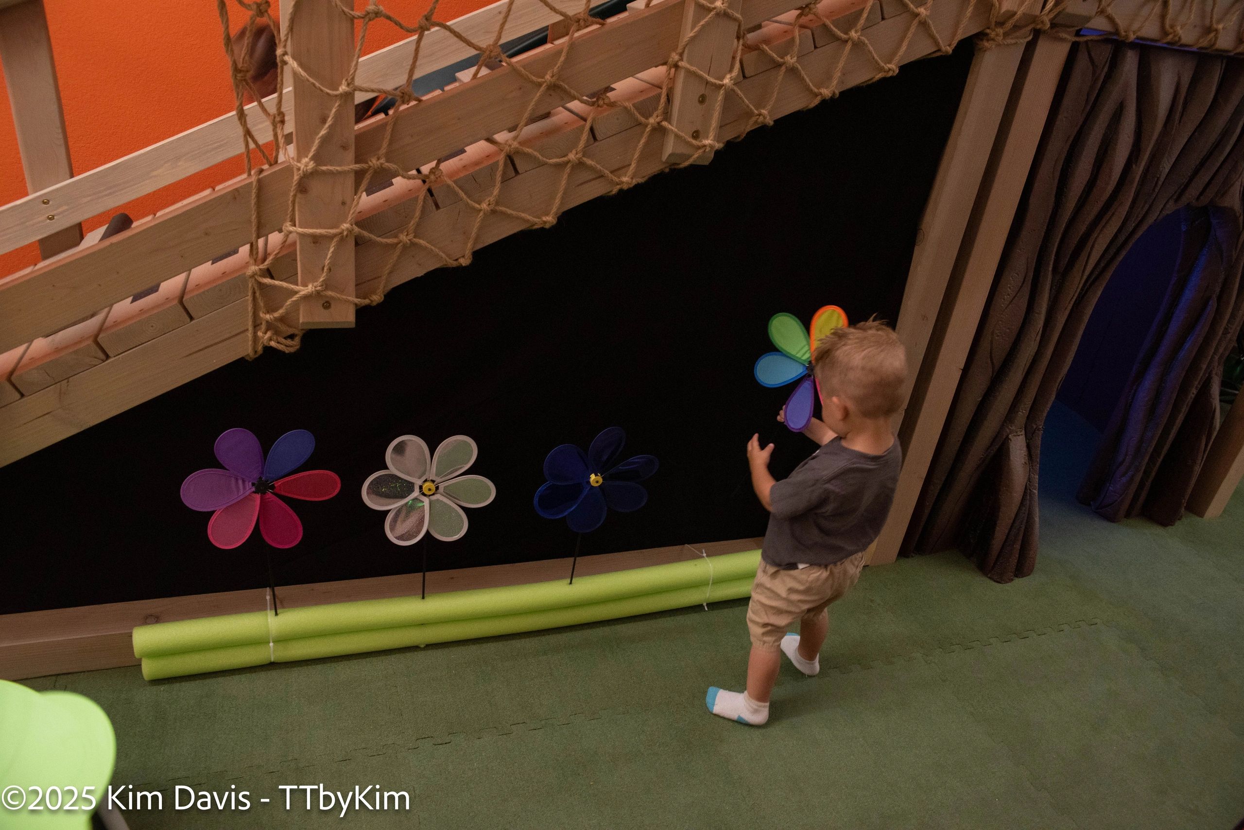 Colorful themed children playroom with imaginative play areas